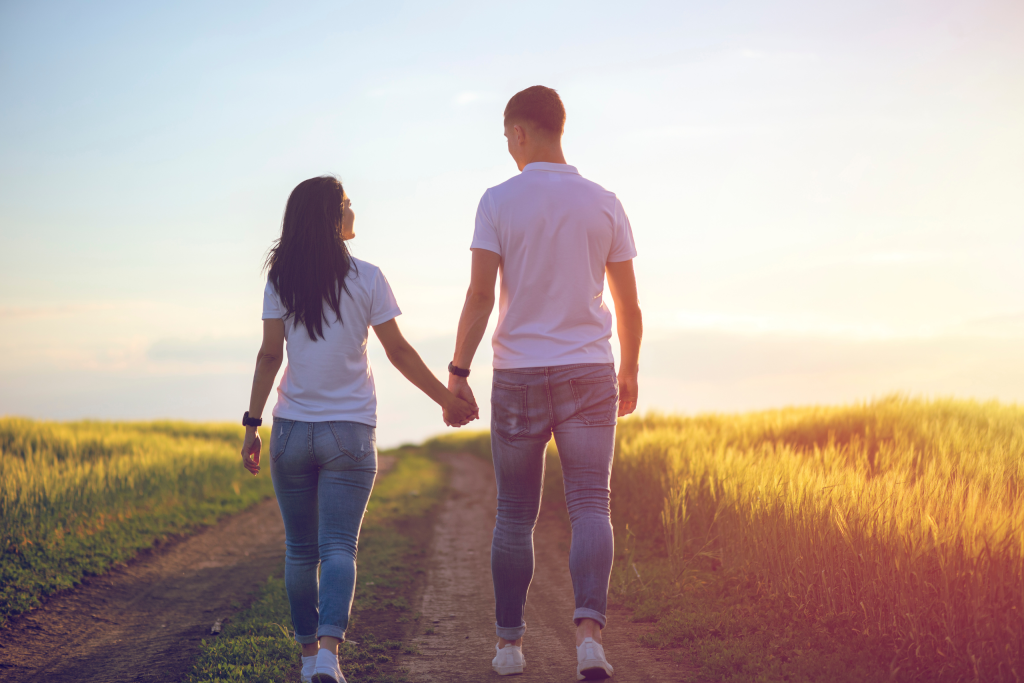 Couple Holding Hands During a Quiet Walk